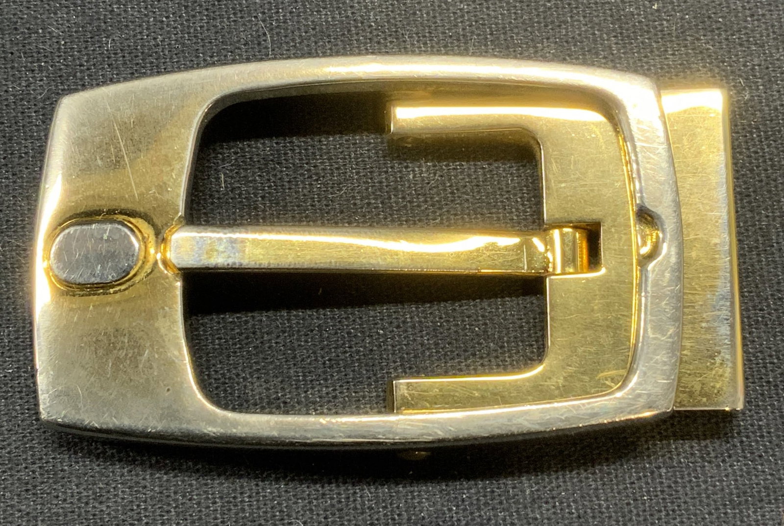 Maoler Gold Tone Belt Buckle, Italy: Maoler gold tone belt buckle. Signed to underside. Made in Italy. Measures approx. 2 3/8 x 1 3/8 inches. Some scratching and loss to finish observed. Maoler, Maoler belt buckle, ladies belt buckle, la