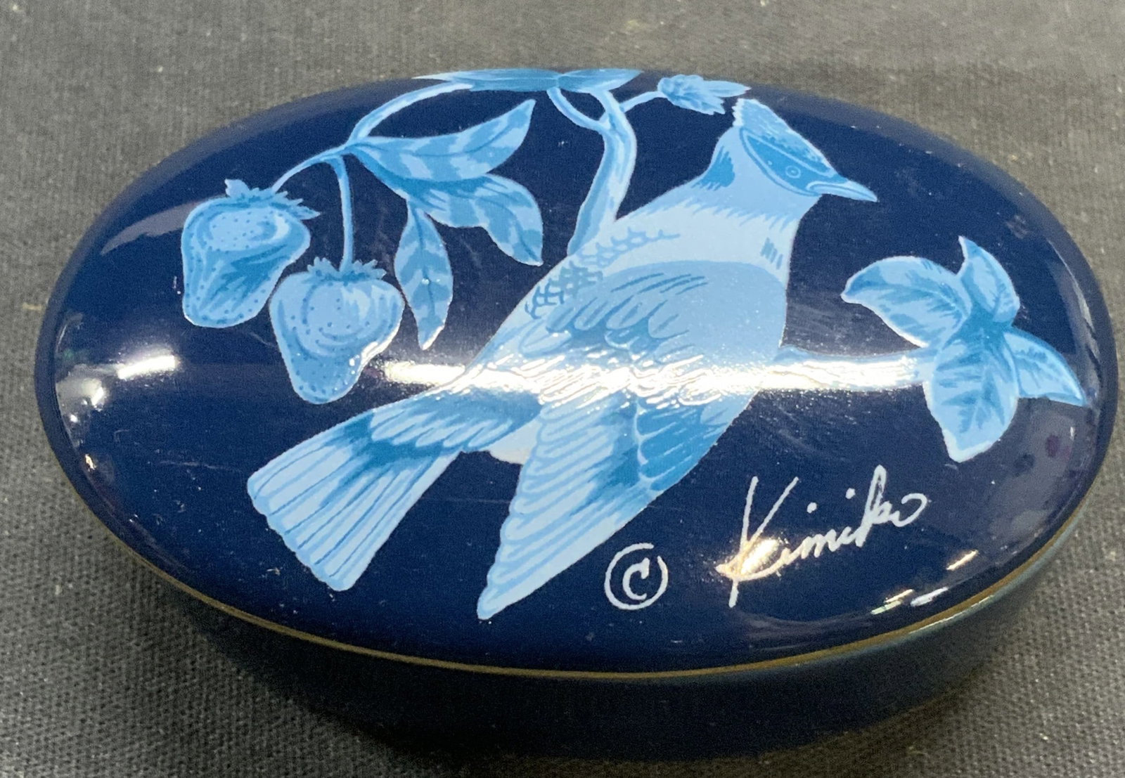 OTAGIRI Kimiko Ikeda Porcelain Bird Trinket Box JP: OTAGIRI Kiiko Ikeda porcelain trinket box with bird motif in blue. Made in Japan. Trademarked to lid. Measures approx. 3 x 2 x 1.25 inches. Some surface wear including scratching observed. OTAGIRI, OT
