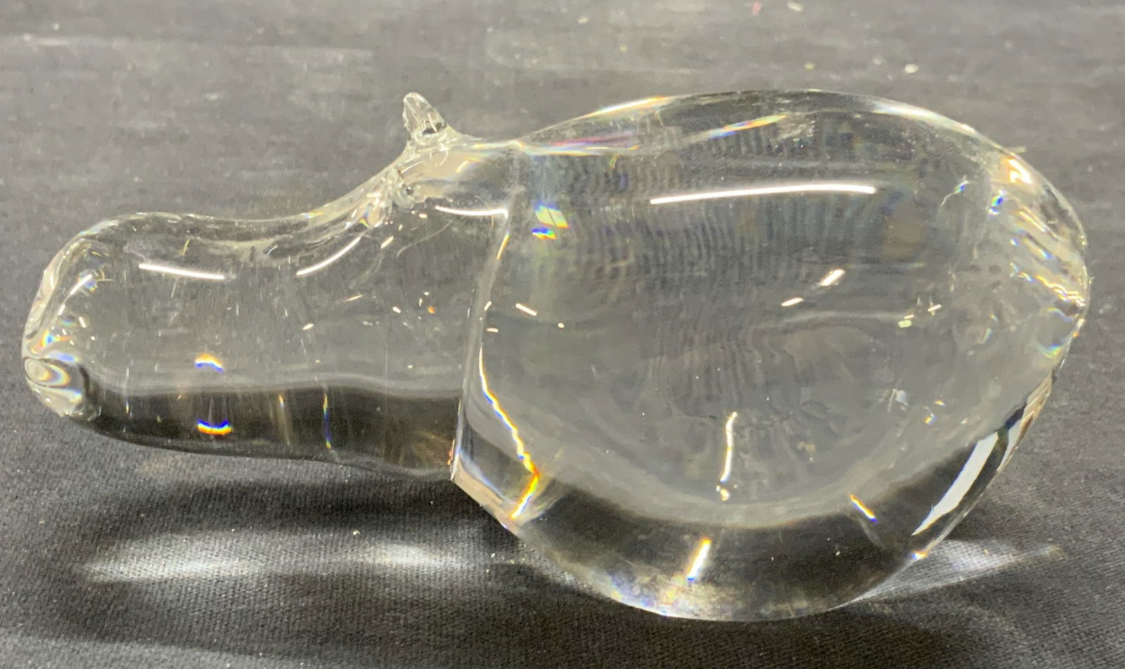 Holmegaard Crystal Hippopotamus Figural: Holmegaard crystal hippopotamus figurine. Signed to underside. Piece has weight. Measures approx. 4.5 x 2 x 2 inches. Some scratching and small chips observed. Holmegaard, HOLMEGAARD hippopotamus, HOL