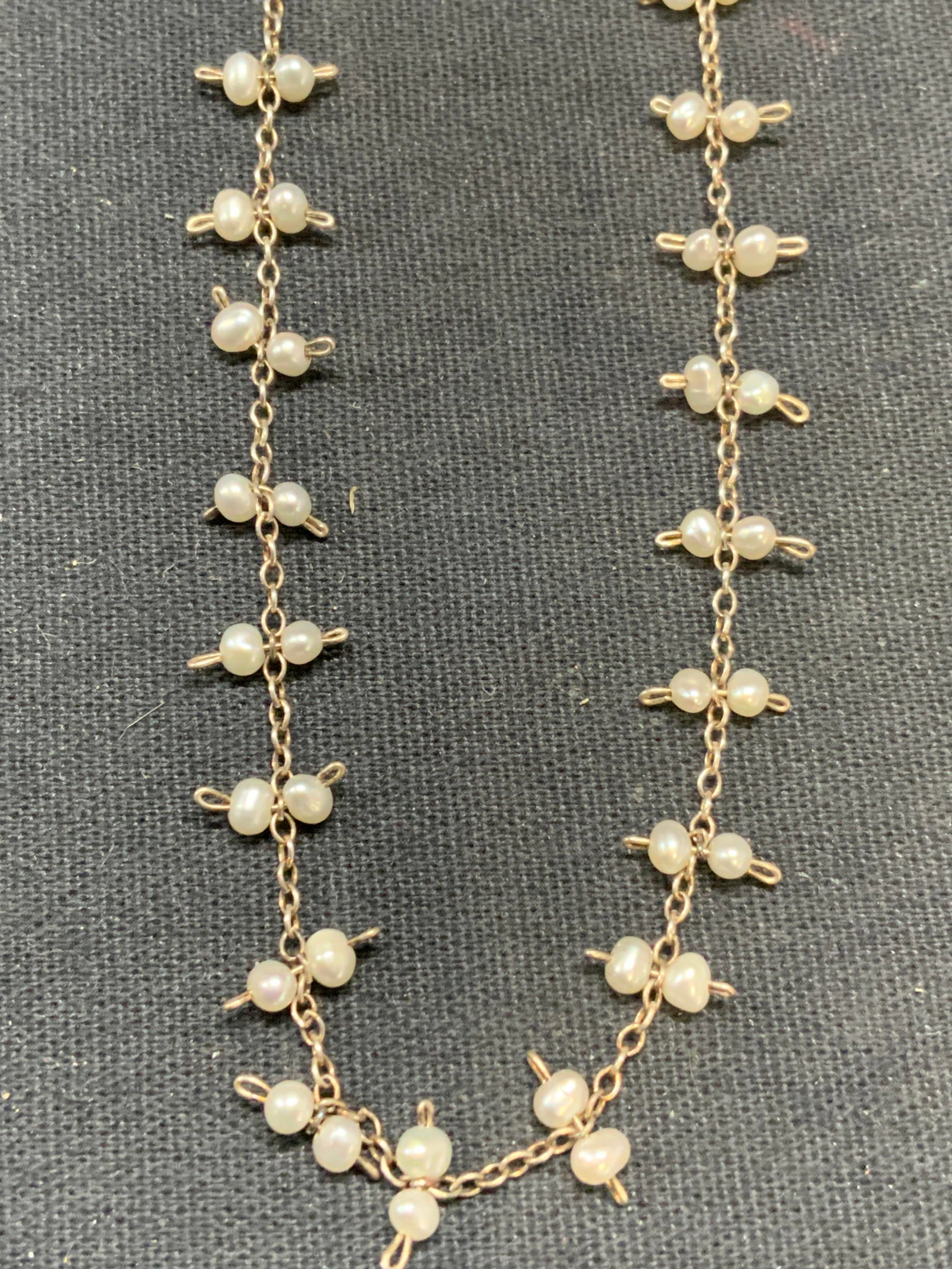 Sterling Silver Seed Pearl Choker Necklace: Sterling silver choker necklace with seed pearl beads. Marked sterling on clasp. Drop length approx. 7.5 inches. Total weight 2.6 grams. Some surface wear including scratching observed. Estate jewelry
