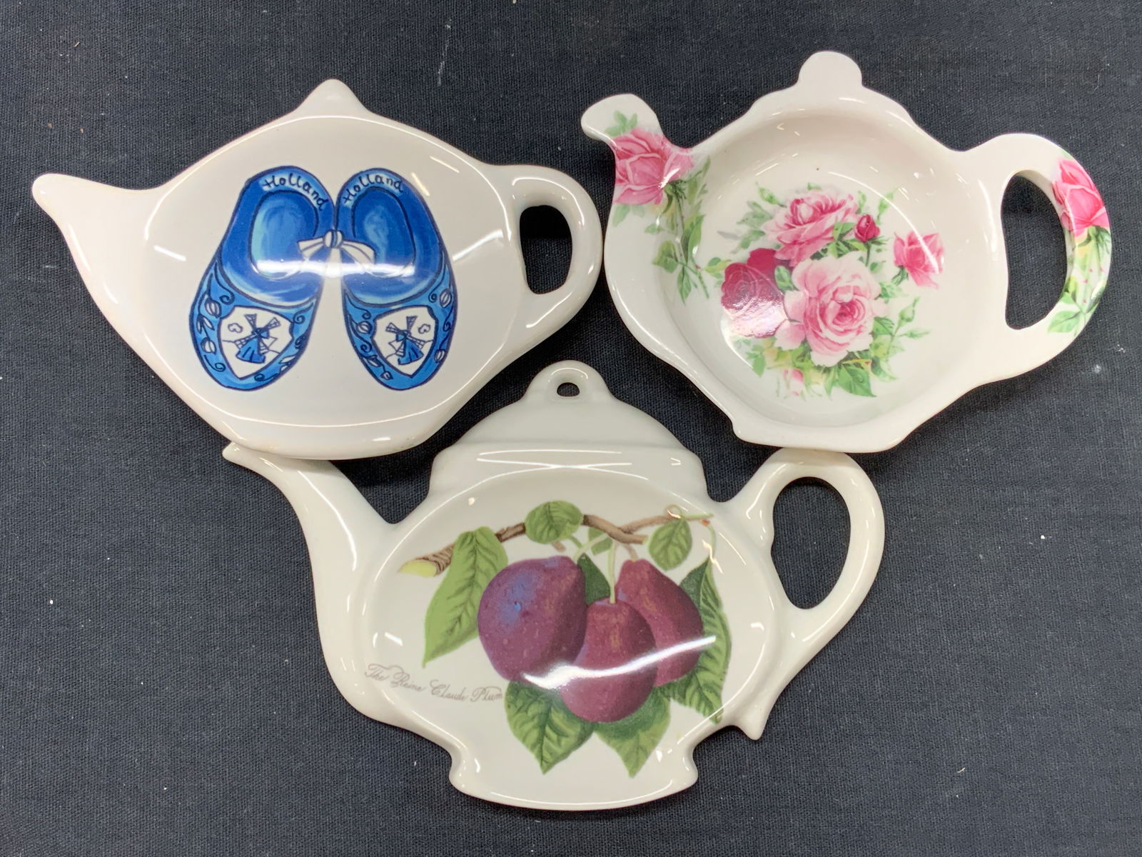 Lot 3 Fine China Tea Bag Holders, PORTMERION +: Lot of 3 fine china tea bag holders. 1 PORTMERION, Southfield, bone China and another hand painted with clogs with the word Holland in the center. Approx 6 and 5 inches wide. Minor wearing to fine chi