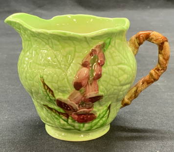 Vtg Carlton Ware Ceramic Cabbage Leaf Creamer: Vintage Carlton Ware ceramic cabbage leaf creamer in green and brown with floral motif. Trademarked to underside. Made in England. Measures approx. 4 x 3 x 3 inches. Some surface wear including scratc