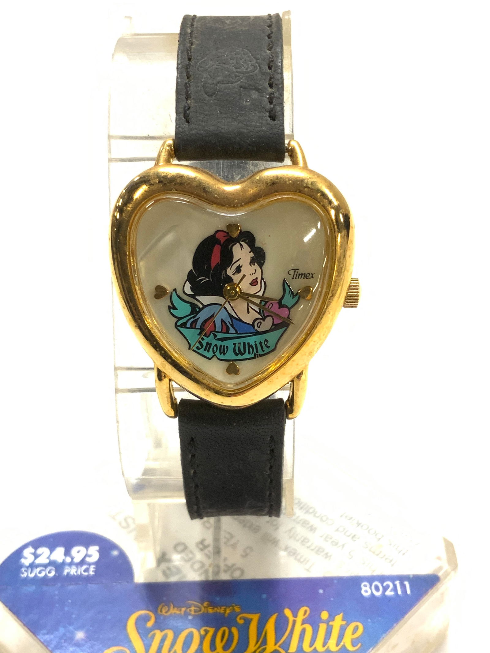 Snow White Timex Wristwatch, New: Novelty Snow White wristwatch by Timex. Heart shape watch face, 1 x 1 in. In gold tone. New old stock on original packaging with instructions., leather wristband with images of the dwarfs. Fits Wrist
