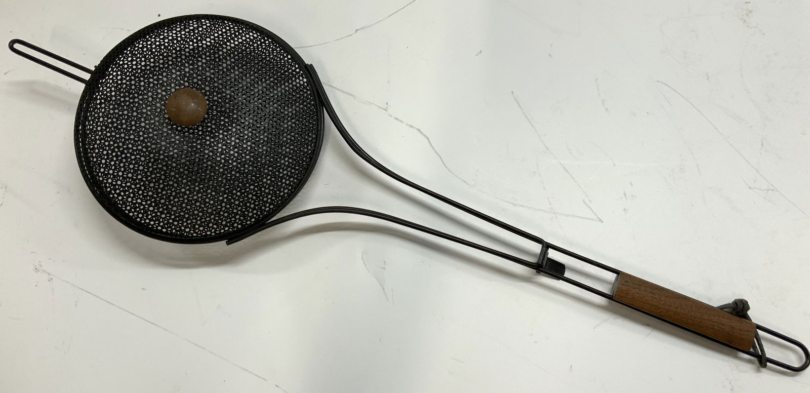 Androck Iron & Wood Handle Campfire Cooker: Marked Androck on lid. Iron made campfire cooker with wooden handle. Approx 31 inches long and 9.75 inch diameter pod. Possibly never used. Minor wearing to wooden handle. Iron cooking pot, cooking wa