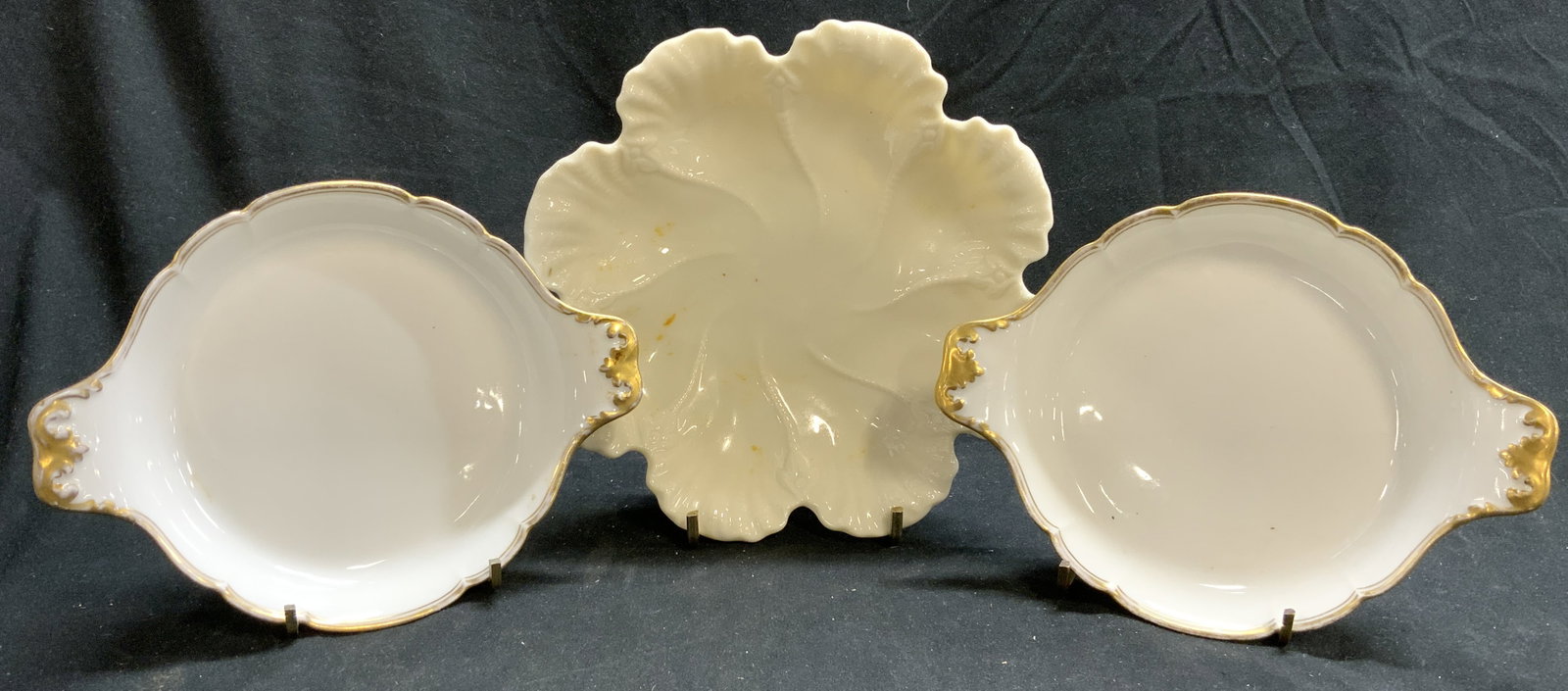 Lot 3 Porcelain Dishes Limoges France & Lenox USA: Lot includes 2 dishes with gilt rims & handles marked LIMOGES WH PLUMMER & CO PORCELAINES A FEU T&V FRANCE, and 1 floral form dish marked LENOX MADE IN USA on undersides. Each dish is porcelain. Lenox