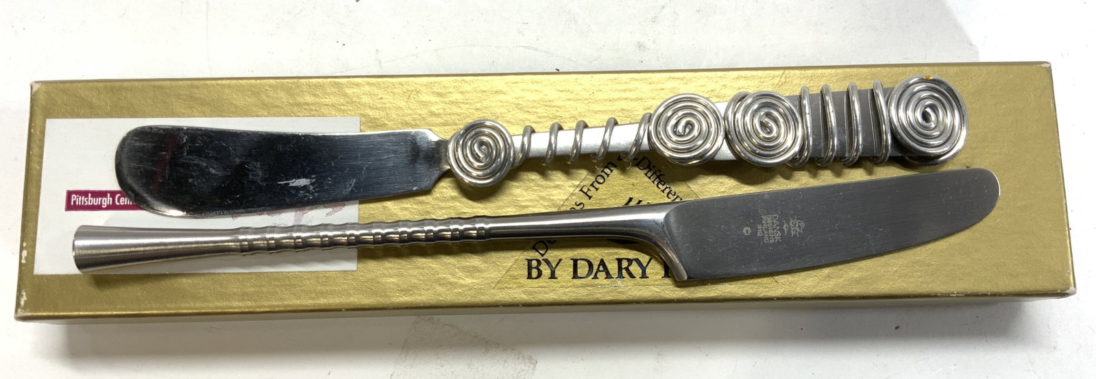 DANSK, CAPCO Stainless Steel Spreader, 2: DANSK stainless steel modernist spreader. Made in Denmark. Hall Marked on blade, 7 in. CAPCO whimsical stainless spreader with metalwork design over handle. 6.75 in. Long Kitchenalia, kitchenware, ute