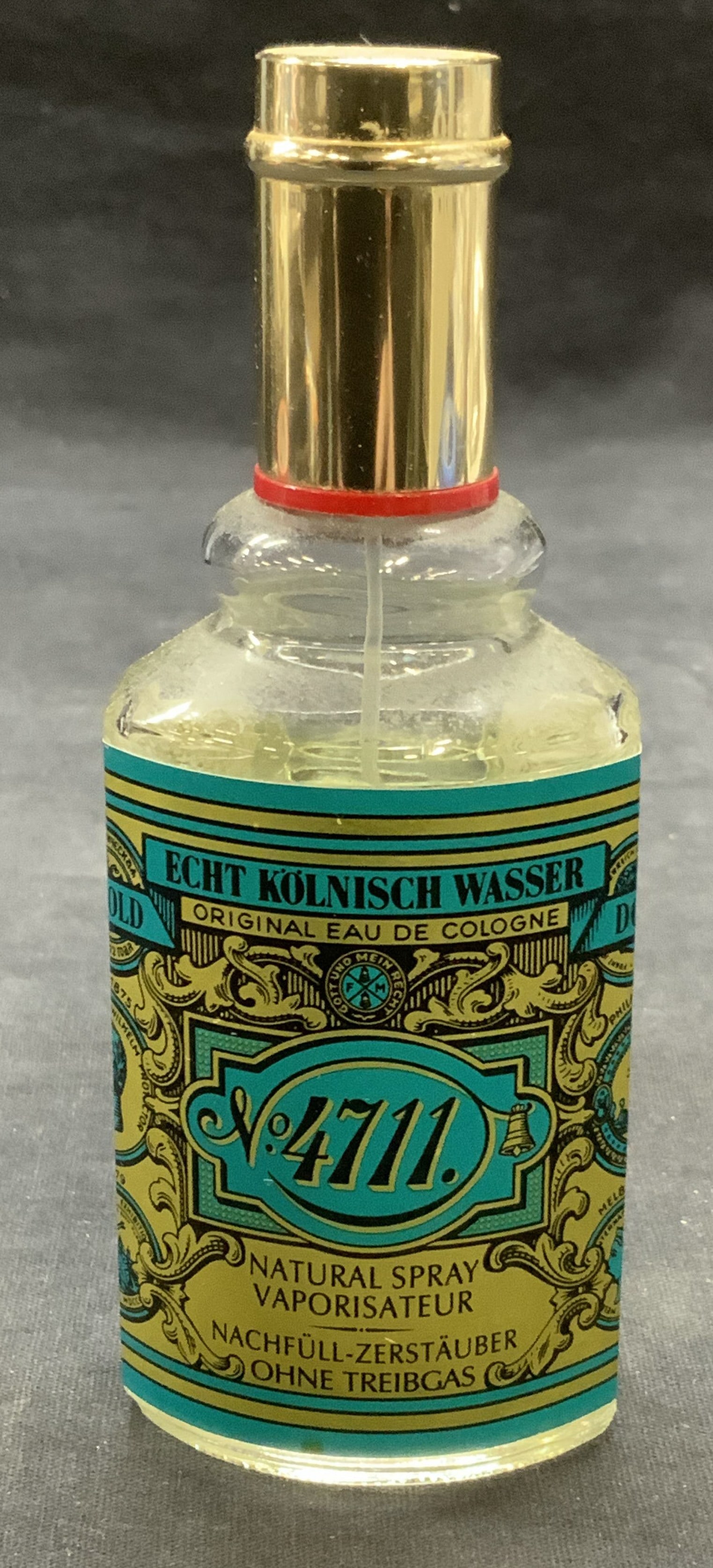 Echt Kolnisch Wasser No 4711 Cologne: Echt Kolnisch Wasser No. 4711 cologne. Glass bottle. As Is, partially full. Measures approx. 2 x 5.5 inches. Some wear to bottle consistent with exposure. Echt Kolnisch Wasser, Echt Kolnisch Wasser co