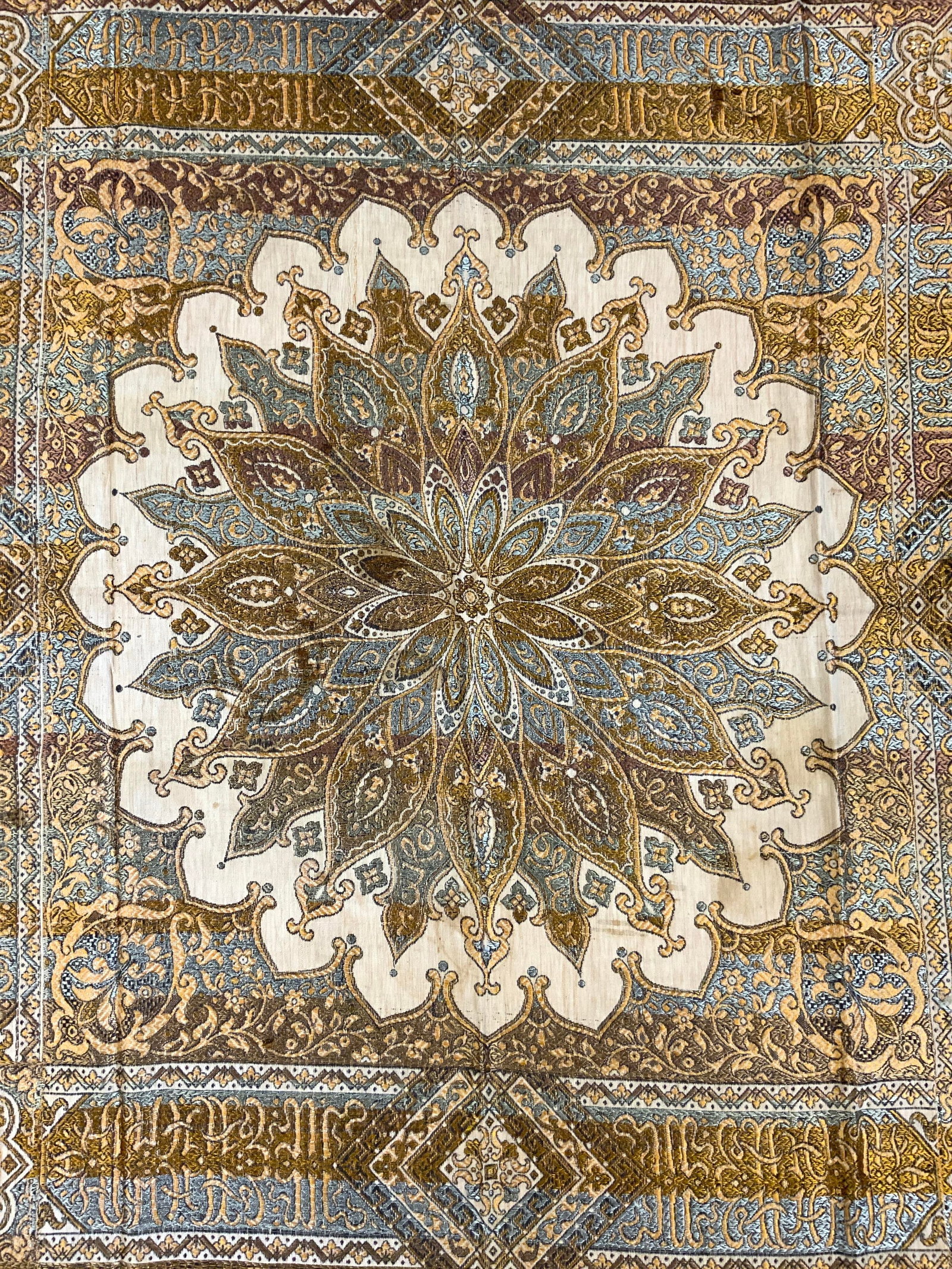 Vintage Fringed Woven Textile: Textile Is vintage. Piece has goldenrod toned fringes at edges. Piece has intricate embroidered floral motif, medallion & geometric detail. Piece measures approximately 57 x 54 inches with fringes. Te