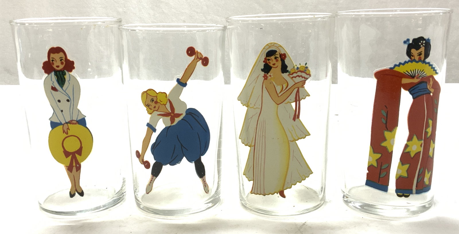 Set 4 Vtg Female Stencil, Semi Nude Glasses: Set 4 vintage tumblers. Each has a female figural in a different costume / outfit and other the interior of that stencil is a semi- nude female. Glasses measure 4.75 in tall x 2.5 in. Wide. Barware, t
