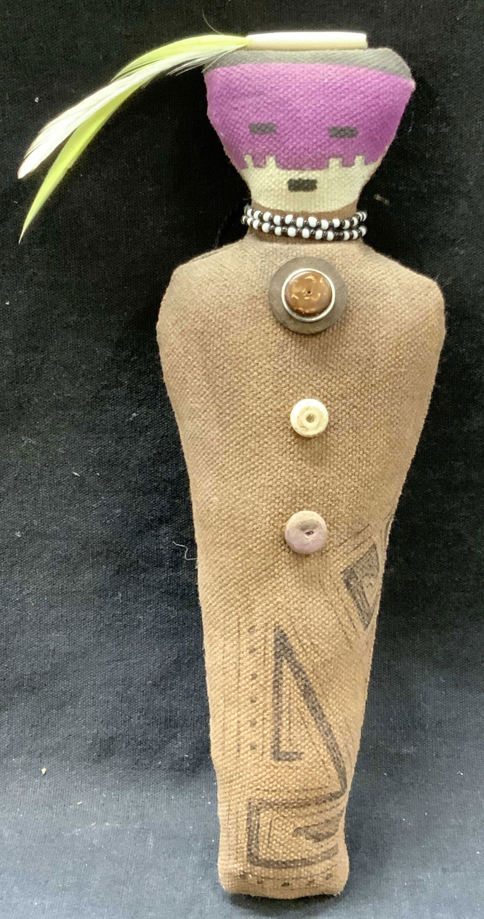 Hand Crafted Tribal Fabric Doll: Hand crafted tribal fabric doll with hand drawn symbols on the body and feathers affixed to the head. Approx 7.5 inches long Moderate wearing to fabric due to age and use, Tribal doll, hand crafted do