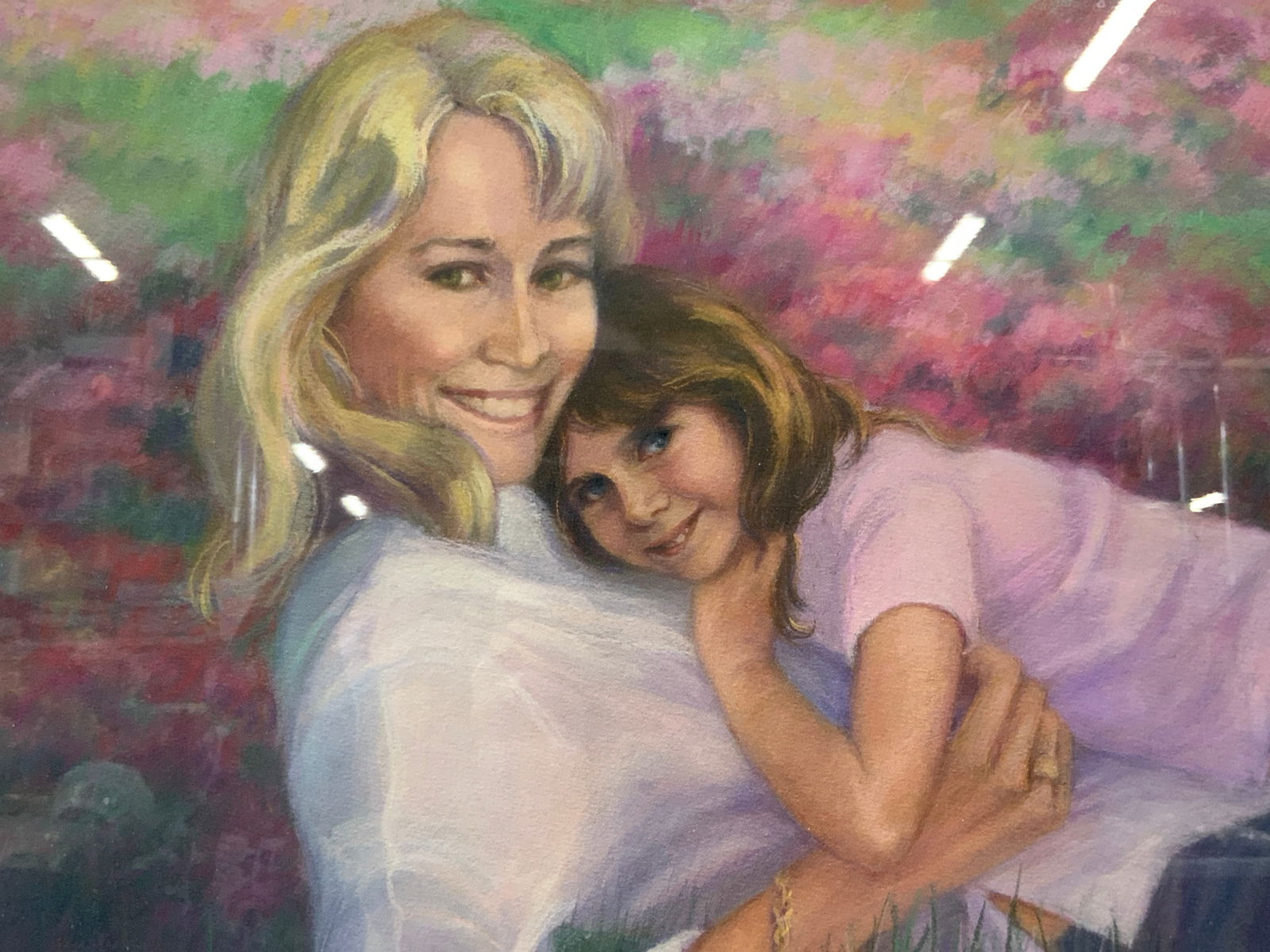 Brenda Manning Pastel Mother & Daughter Portrait: Signed Brenda Manning 2002. Depicts a portrait of a mother and daughter laying in a flower field. Framed in a gold leafed wooden frame with white linen matting and gold leafed inner fillet. Approx 20