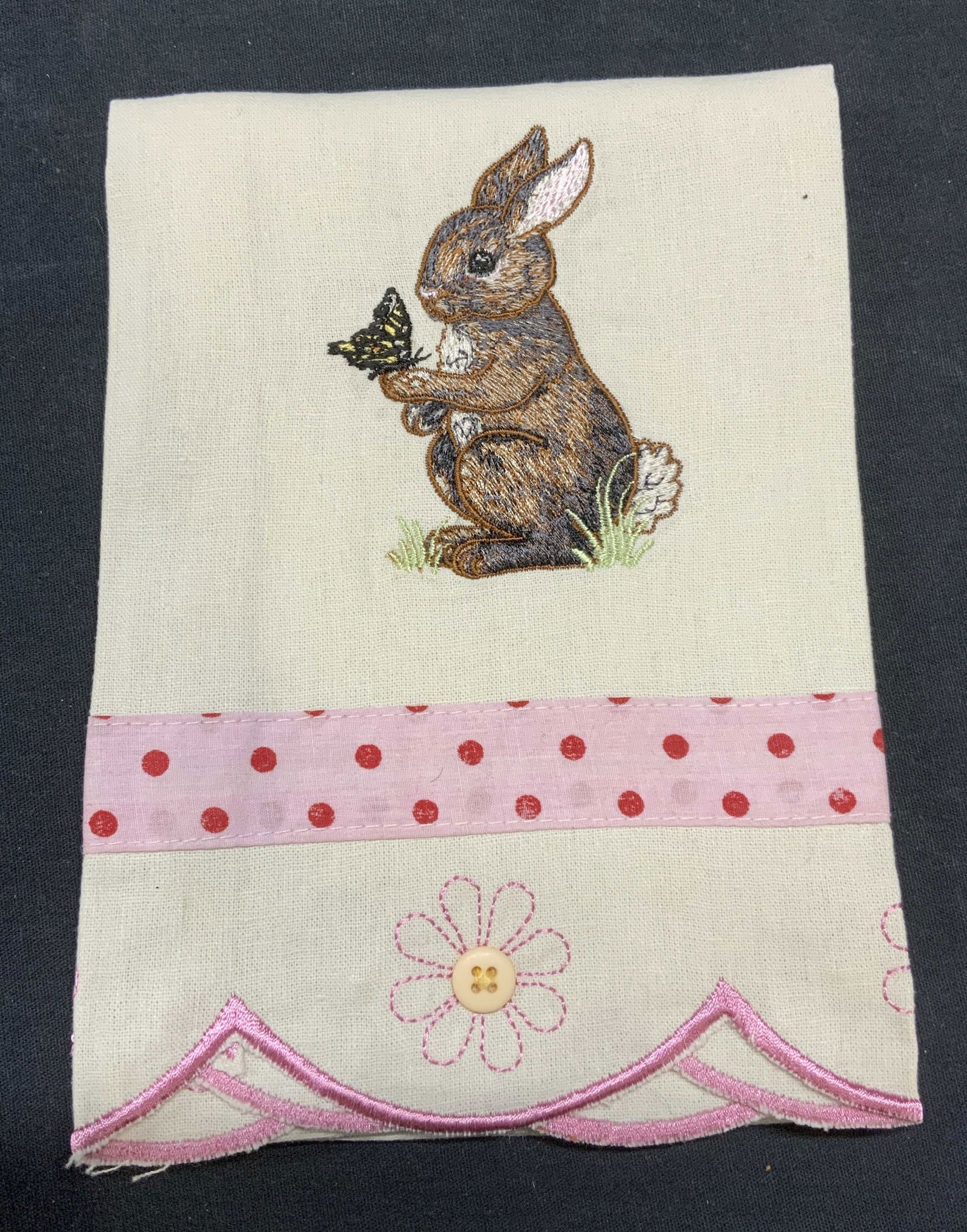 Manual Woodworkers Weavers Rabbit Tea Towel: Manual Woodworkers and Weavers cotton and linen blend tea towel with embroidered rabbit and flower motif. Measures approx. 28 x 15.75 inches some wear to material consistent with exposure. Manual wood