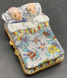 Vtg Hand Painted Couple in Bed Porcelain Pill Box: A vintage hand painted couple in bed porcelain trinket box / pill box. Multicolored hues. Opens with gold tone metal hinge hardware. Underside and interior feature painted designs as well.