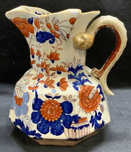 Antique Masons Ironstone China Floral Pitcher: Antique Masons ironstone china pitcher. Red and blue imari style floral pattern. Hand painted. Snake motif handle. Trademarked to underside. Measures approx. 8.25 x 9.5 inches. Some surface wear