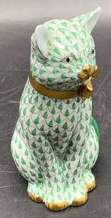 HEREND HUNGARY Green Fishnet Porcelain Cat: A green fishnet Herend Hungary porcelain cat figural featuring a gilt bow tie, gilt paws, and a gilt nose. Signed on underside. Sticker to underside reads Brielle Galleries. Measures approx. 4.5H