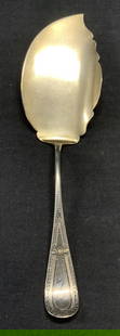 Vintage Sterling Silver Server: Vintage sterling silver serving utensil. Etched floral and scroll pattern on handle. Marked sterling. Measures approx. 10.25 inches long. Total weight 3.58 ozt. Some surface wear including