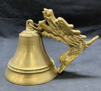 Vintage Heavy Brass Dragon Motif Bell: Vintage brass bell with raised dragon head motif mount. Bell measures approx. 5 x 5.25 inches. Dragon head mount measures approx. 5 x 5 inches. Piece is heavy. Some surface wear including