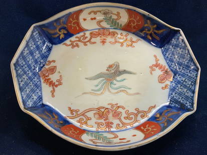 Vintage Imari Porcelain Dish: Ceylon blue vintage porcelain Asian dish with cobalt blue, and orange hand painted Asian decor with gilt. Center Phoenix. Lots of pitting, indicative of older age of piece. No marks. Measures 6.5
