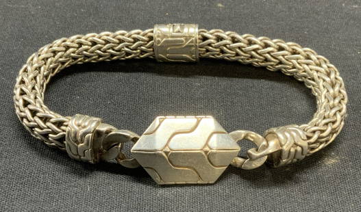 John Hardy Sterling Silver Mesh Chain Bracelet: John Hardy sterling silver mesh chain pendant bracelet. Embossed geometric design. Signed on pendant, marked 925. Measures approx. 9 inches long. Total weight 2.63 ozt. Includes jewelry pouch.