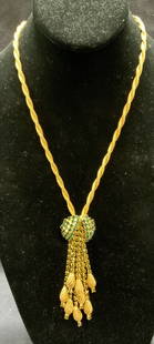 Vintage Gold Tone Green Crystal Necklace: Vintage gold tone twisted chain pendant necklace with green crystal decorated tassel pendant. Drop length approx. 9.5 inches. Pendant and tassel measure approx. 3.5 inches long. Includes jewelry
