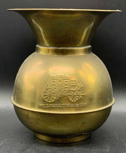 WELLS FARGO & CO. Vintage Brass Spittoon: A vintage brass spittoon. Stagecoach image to obverse and reverse. Obverse and reverse read WELLS FARGO & CO. OVERLAND STAGE. Piece is weighty. Dents to metal, discoloration, and surface wear