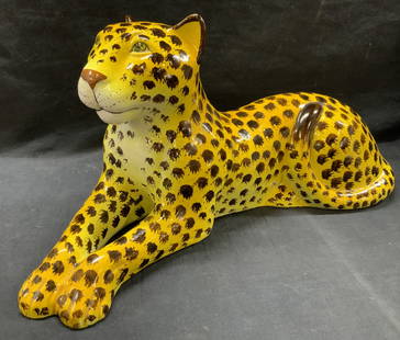 Hand Painted Ceramic Leopard Figural 21 Inch Long: Approx 21 inches long and 11 inches tall. A ceramic made hand painted leopard cat figure lying down. Moderate wearing to ceramic and to underside. Hand painted ceramic cat figure, hand painter 