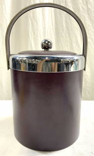GEORGES BRIARD Pebbled Leather & Metal Ice Bucket: Underside is marked GEORGES BRIARD. Ice bucket is metal and pebbled leather. Leather areas are dark maroon toned. Ice bucket has arch form handle. Bucket includes lid. Lid has spherical shaped