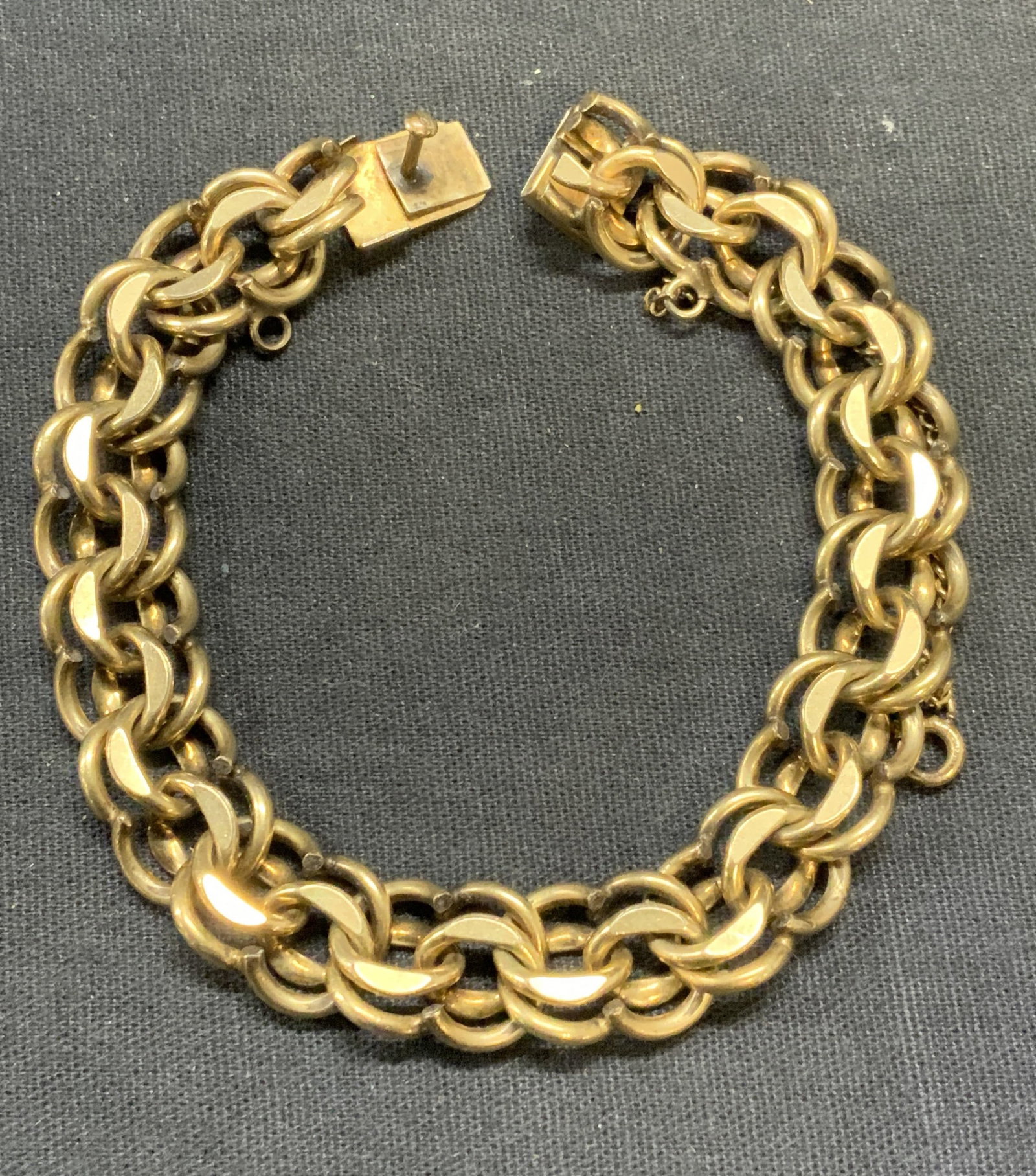 Vintage 12k Gold Filled Chain Link Bracelet: 12k gold filled chain link bracelet. Marked 12k GF on clasp. Measures approx. 7.5 inches long. Some surface wear including scratching observed. Estate jewelry, costume jewelry, cocktail jewelry, fashi