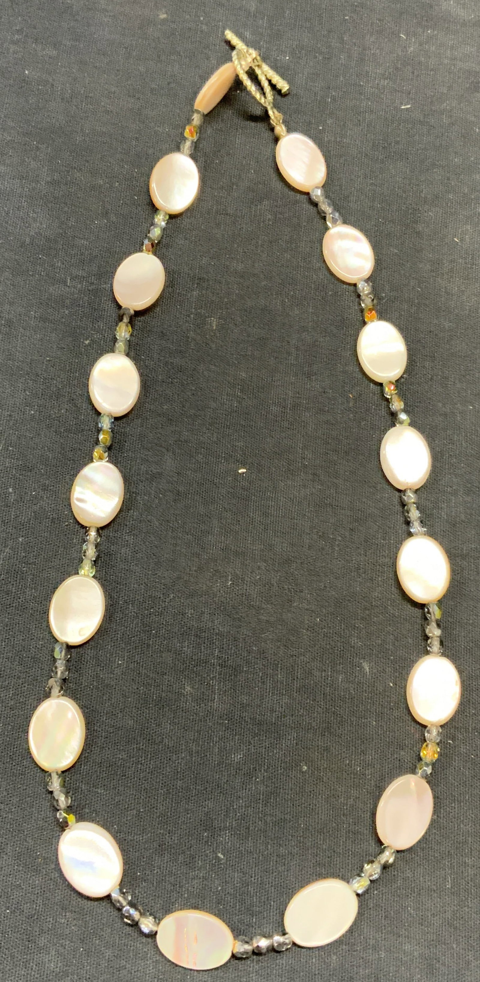 Vintage Mother of Pearl Crystal Beaded Necklace: Vintage mother of pearl disc and crystal beaded necklace. Drop length approx. 8.5 inches. Some surface wear including scratching observed. Estate jewelry, costume jewelry, cocktail jewelry, fashion je