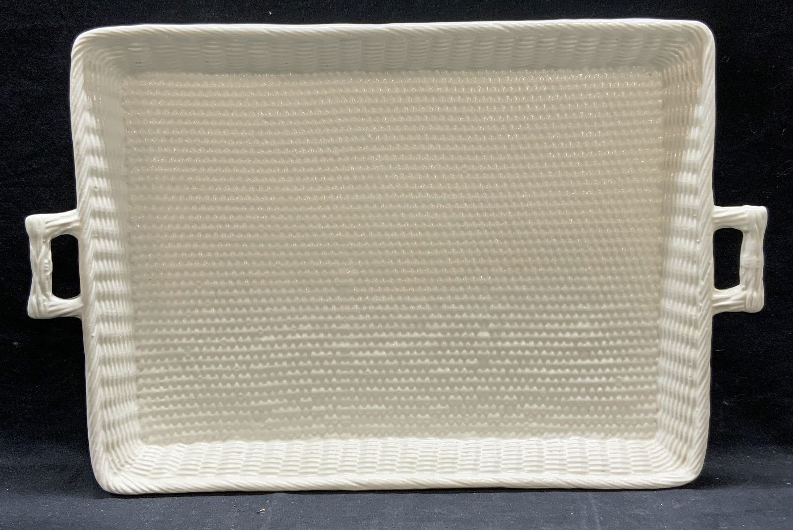 Vtg Tiffany White Ceramic Basket Weave Tray, Italy: Vintage Made in Italy for Tiffany and co white ceramic tray with raised basket weave pattern and two handles. Signed to underside. Measures approx. 17 x 12.75 x 2 inches. Piece has weight. Some surfac