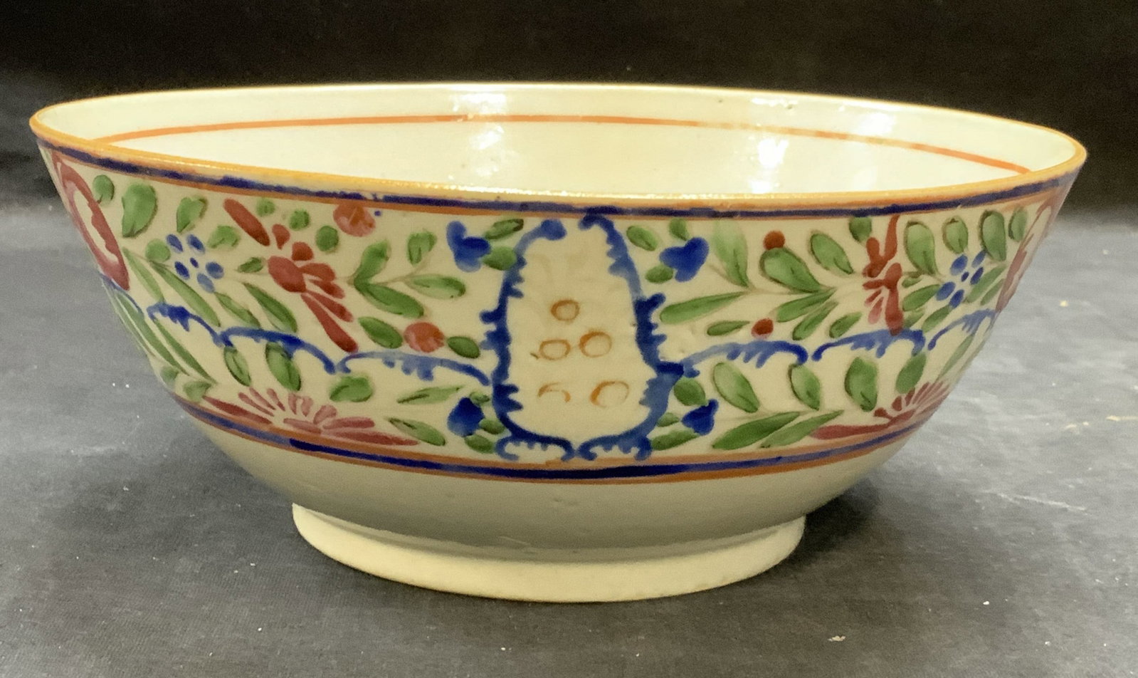 Antique Chinese Export Porcelain Floral Bowl: Antique Chinese export porcelain bowl. Hand painted with floral motif in pastel hues of pink, green, And blue. Measures approx. 7.5 x 3 inches. Some surface wear including scratching and loss to paint