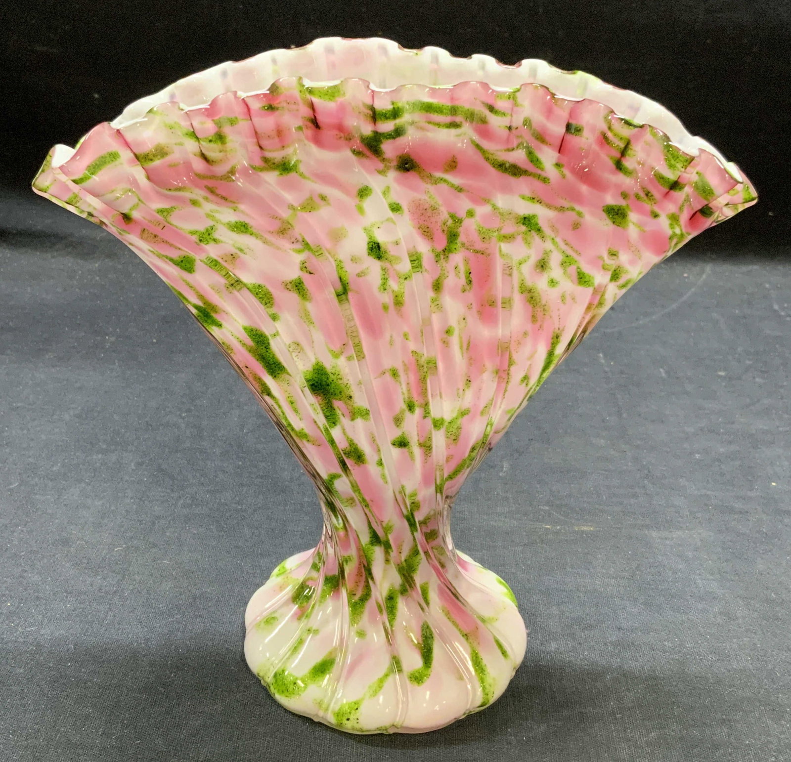 Vintage Pink & Green Art Glass Fan Vase: Vintage pink, green, and white toned art glass fan vase with handkerchief rim. Measures approx. 7.25 x 3.5 x 7 inches. Thick walled glass, piece has weight. Some surface wear including scratching obse