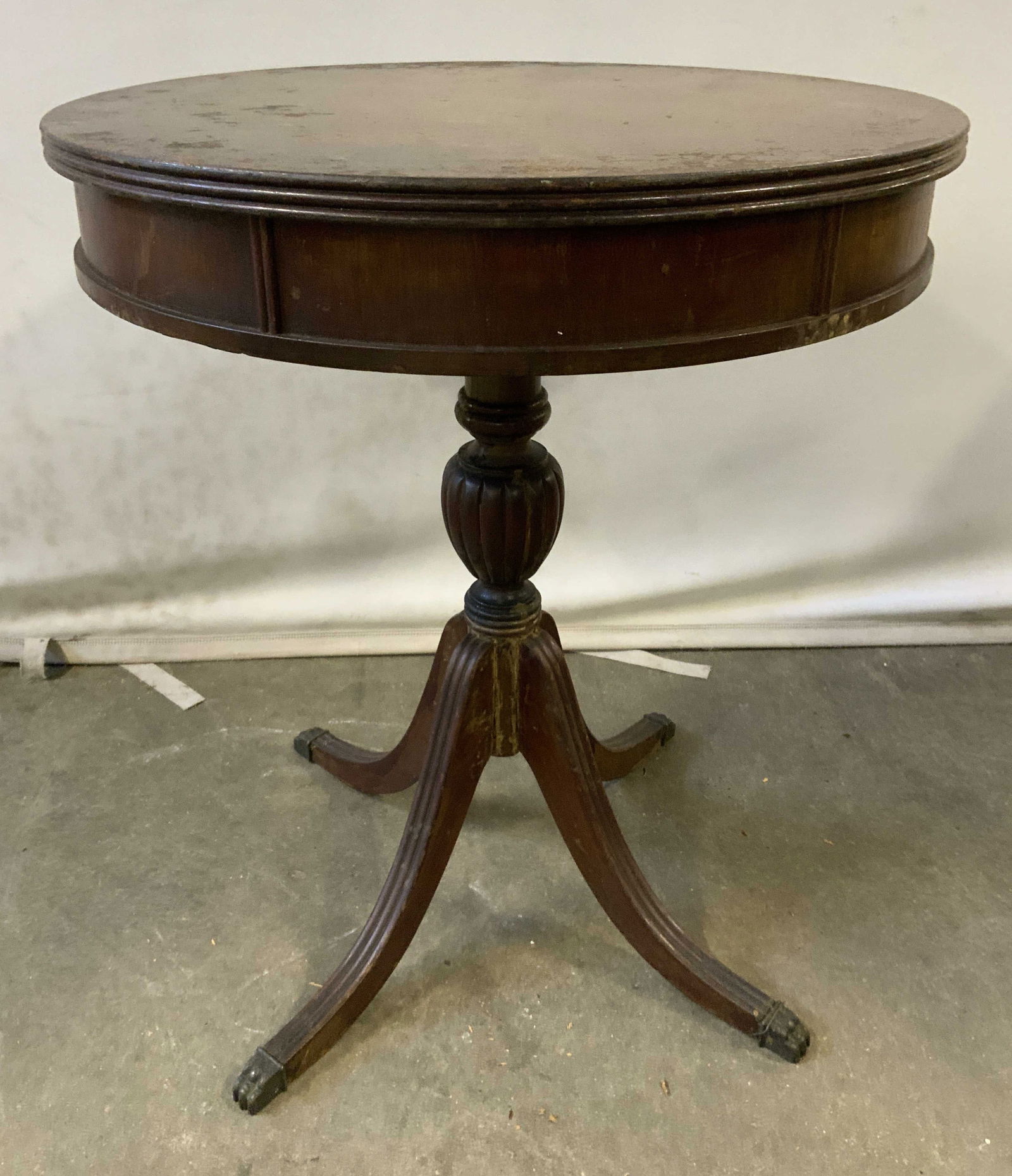 FERGUSON BROS Wooden Pedestal Drum Table: Tag on Underside reads FERGUSON BROS. Table is vintage and wooden. Table is pedestaled with quad pod legs & brass talon feet. Tabletop has circular shape. Piece measures approximately 24 inches tall 2