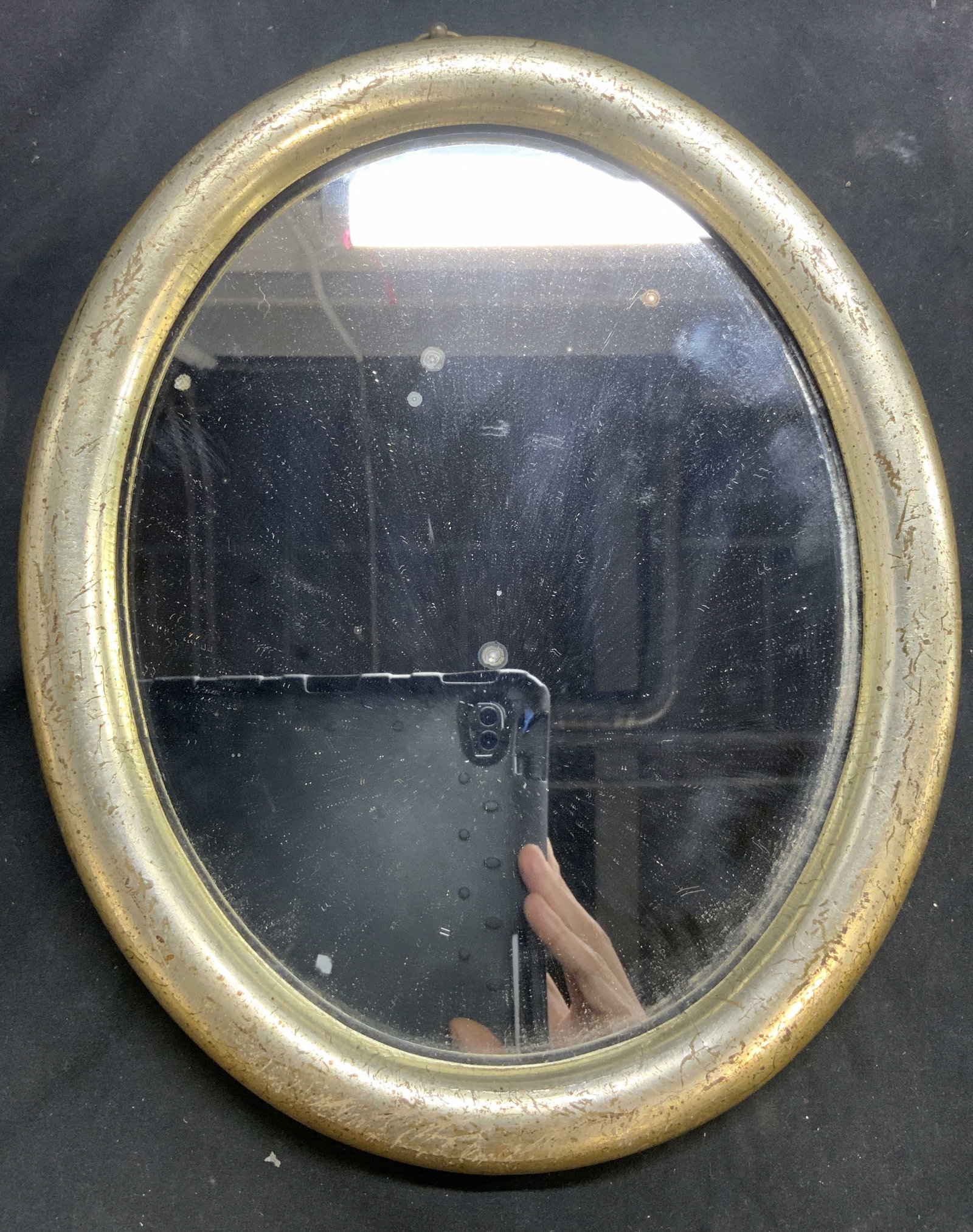 BORGHESE Italian Oval Gilt Wood Mirror: Tag on backside reads BORGHESE. Mirror has oval form. Frame is gilt wood. Piece is Italian appears to be vintage. Mirror measures approximately 11.5 inches tall 9 inches wide. Mirror, wall mirror, BOR