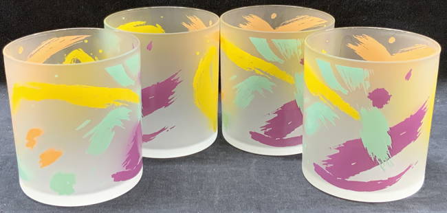 Set 4 Retro Drink Bar Glasses: Set of 4 retro drinking glasses with yellow, green purple and orange streaks of color on exterior. Approx 3.25 inches tall and 3 inch diameter. Minor surface wearing. Retro glasses, drinking