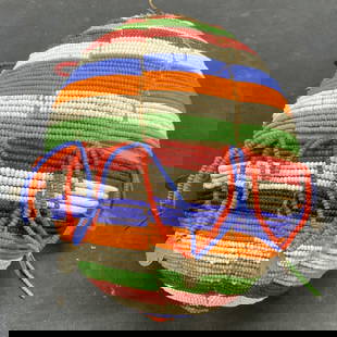 Vintage Hand Beaded Sphere Figural: Vintage hand beaded sphere figural. Multi color blue, red, orange, green, and white. Measures approx. 6.5 inches wide. Some loss to beading and wear to material observed. Beaded sphere, sphere