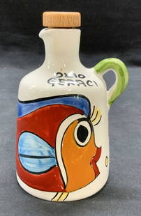Nino Parrucca Ceramic Olive Oil Bottle: Nino Parrucca ceramic olive oil bottle. Hand painted with fish motif. Marked Olio Geraci. Signed along base. Measures approx. 3.5 x 5.25 inches excluding stopper. Some surface wear including