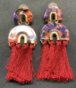Gold Tone Red Tassel Statement Earrings: Gold tone purple and red toned acrylic decorated earrings with red tassels. Post backing. Measure approx. 3 x 1.25 inches. Some surface wear including scratching observed. Estate jewelry, costume