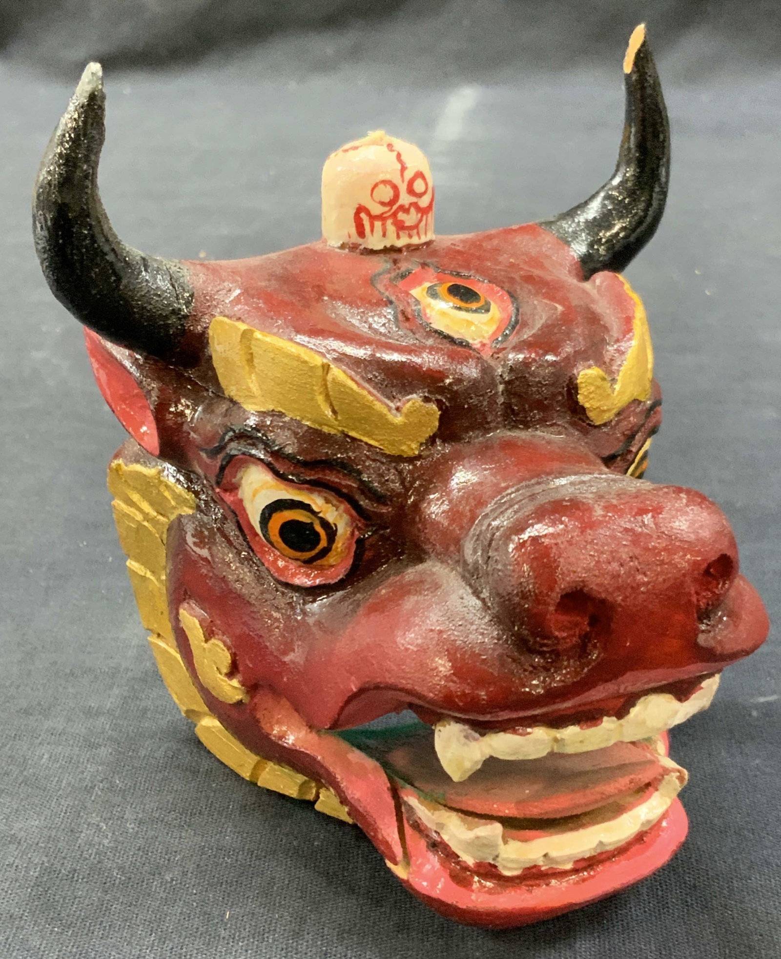 Vtg Hand Crafted Wooden Tibetan Dragon Accessory: Vintage hand carved and painted wooden dragon head with the Dragon heaving a third eye on its forehead and a skull on the top of the head. Approx 4 inches tall and 4 inches side. Moderate wearing to p