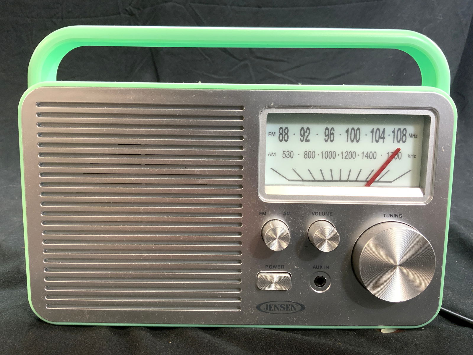 JENSEN Vintage Am Fm Radio W Handle: Radio is trademarked JENSEN. Piece is mint green toned. Radio has handle. Piece has extendable antenna, power button, tuning knob, am/fm knob, and Volume knob. Radio with handle up measures approximat