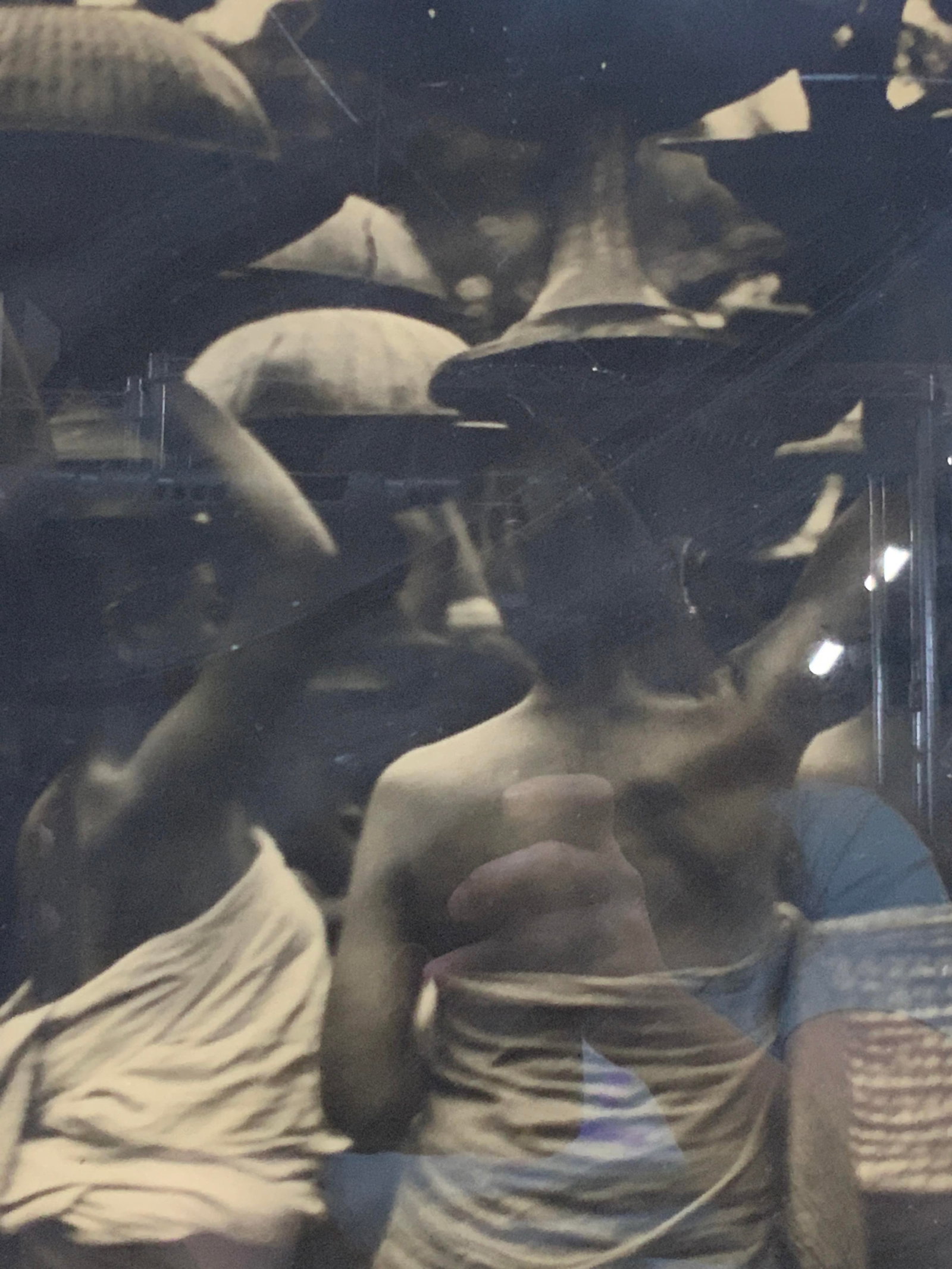 Framed Black & White Figural Photograph Print: Frame Photograph print in black and white of a group of woman holding vessels atop their heads. Framed in a black wooden frame with yellow mat board, approx 19 x19 inches window measures 11 x 11 inche