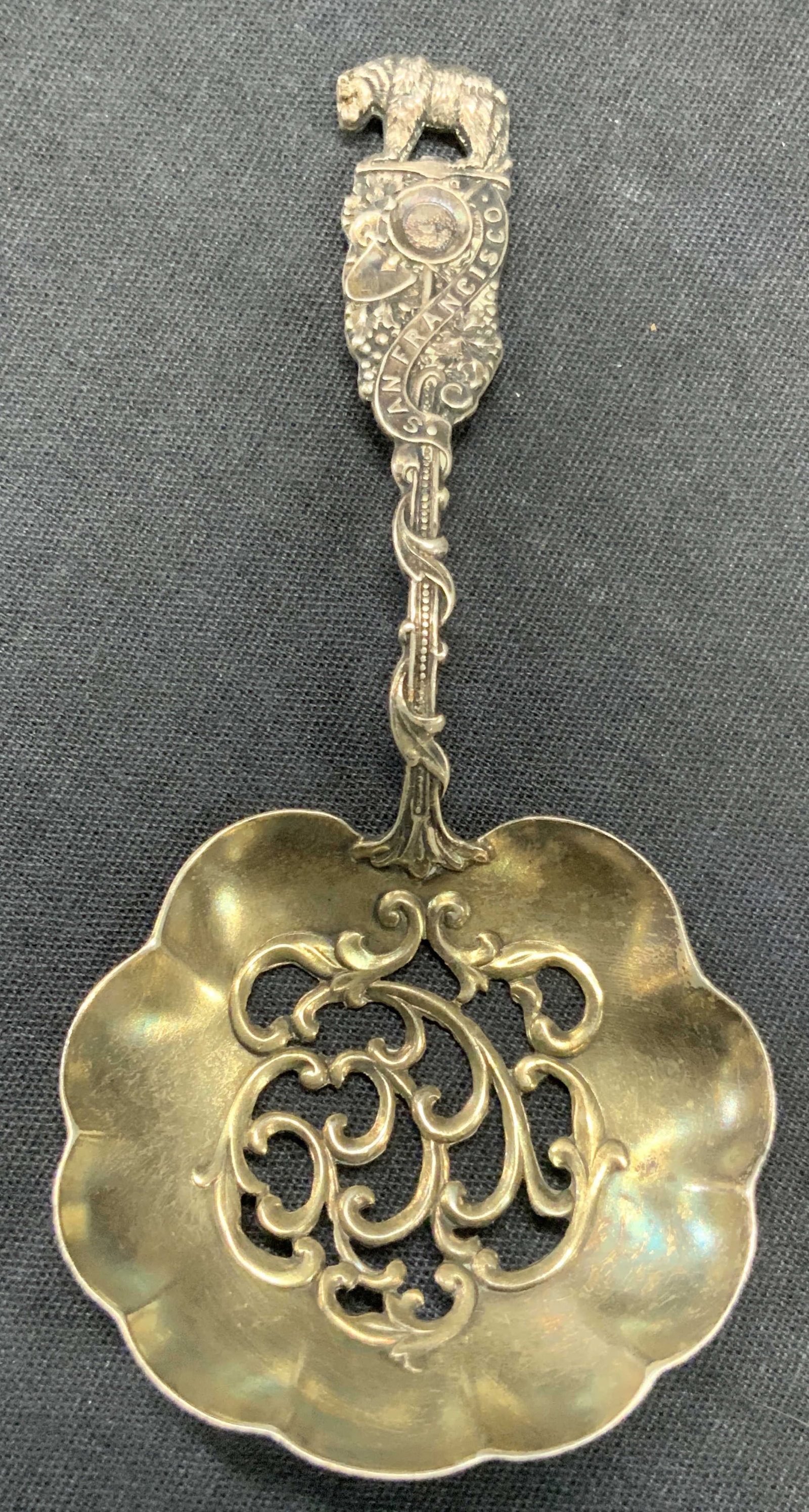 Vtg Sterling Silver California Granulated Spoon: Vintage sterling silver granulated spoon marked on handle, San Francisco, with a vine going up the handle and the California Bear on the top with motifs of flowers and a shovel. Granulated oil spoon w