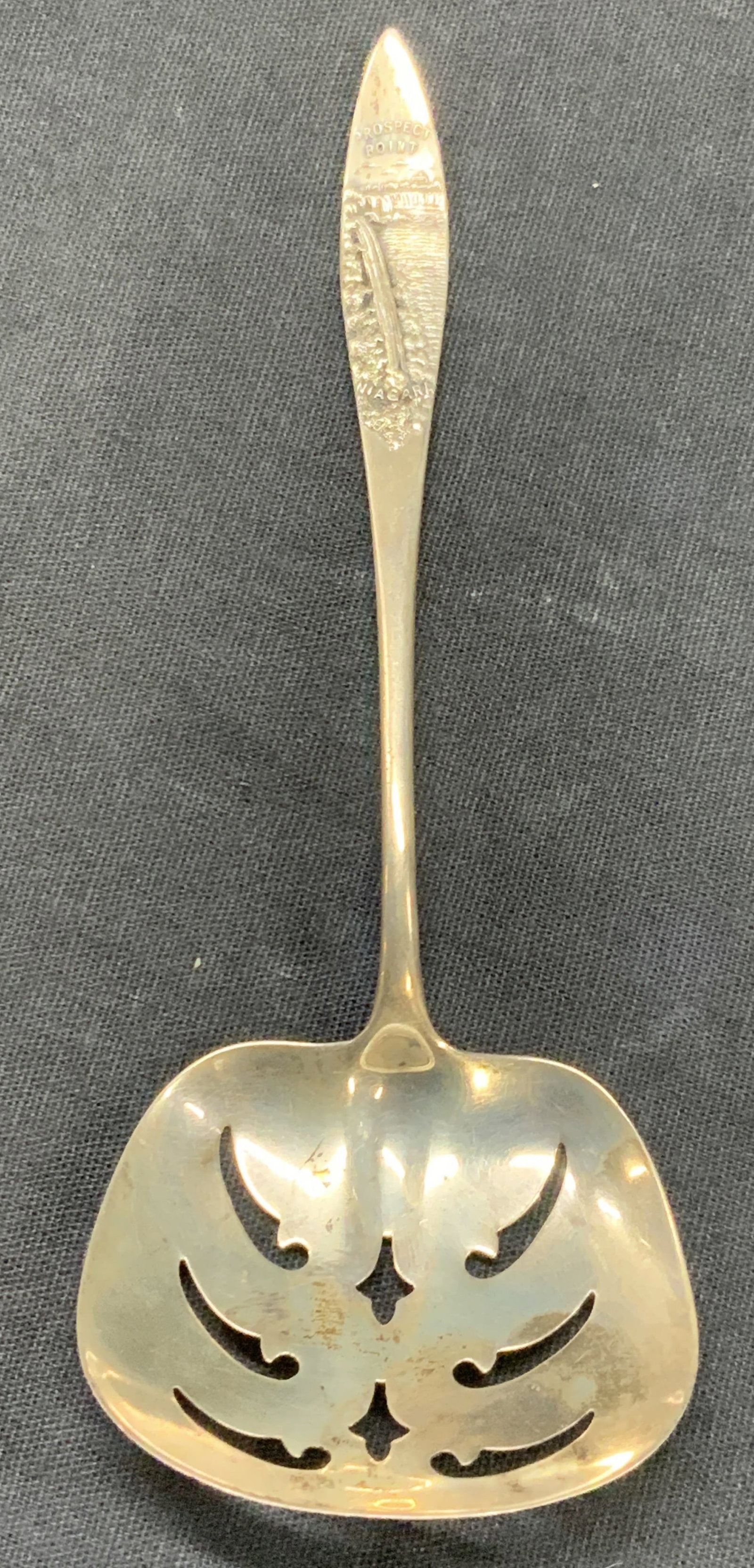 Sterling Silver Prospect Point Granulated Spoon: Vintage granulated spoon marked Prospect point with embossed images on handle. Granulated spoon. Marked sterling on underside. Approx5.25 inches long. Moderate wearing due to age and use. Total weight