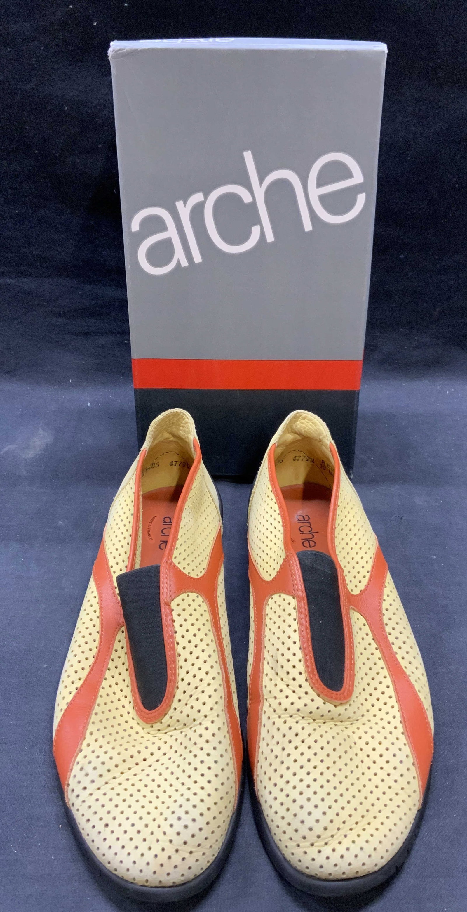Arche Yellow & Orange Perforated Flats: Arche yellow and orange leather trim perforated flats. Size 10. Made in France. Some wear to material and soles consistent with exposure. Includes shoe box. Arche, arche flats, Arche shoes, ladies des