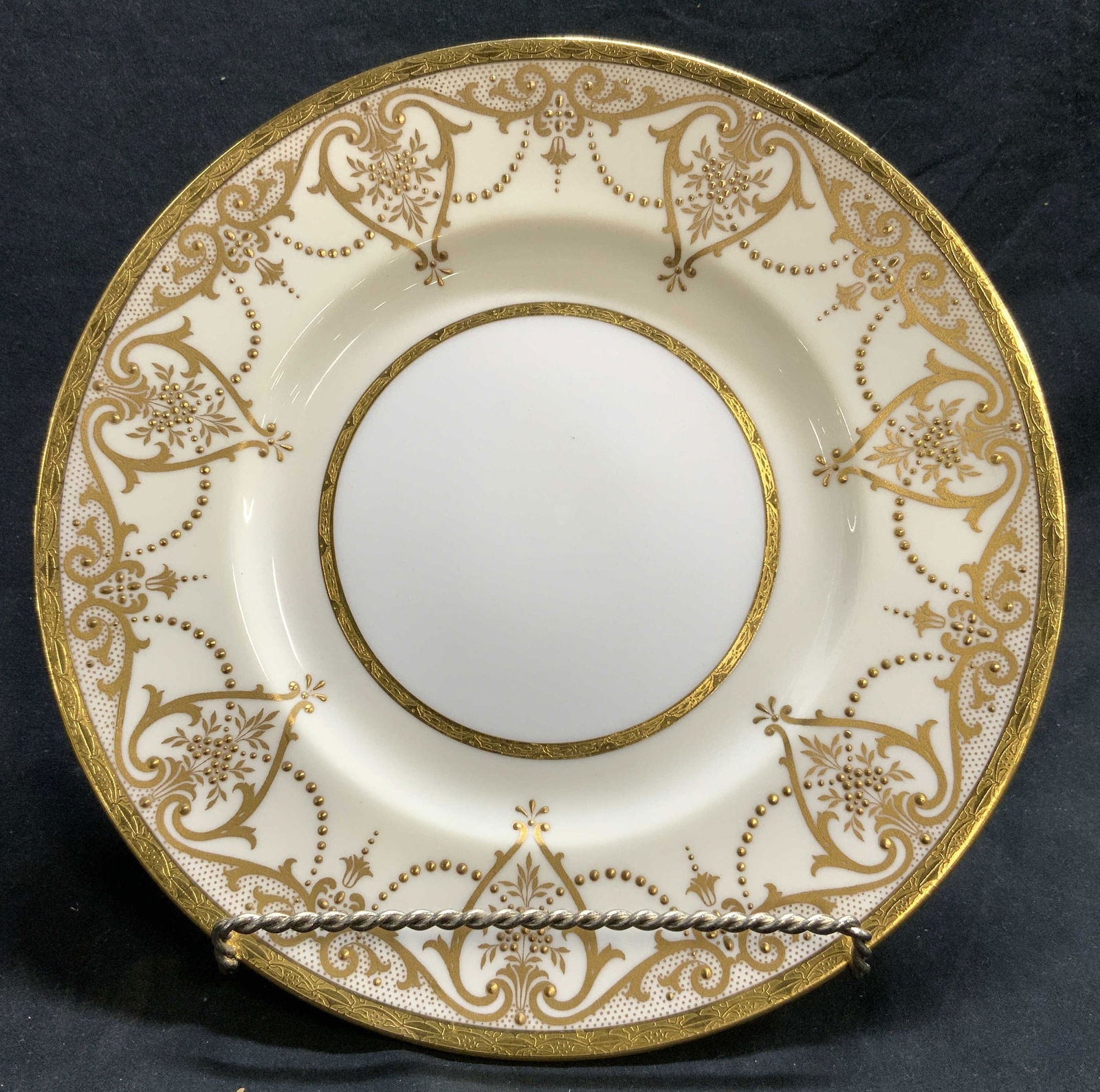 MINTON OVINGTON BROTHERS Gilt Porc Plate ENGLAND: Underside reads MINTON OVINGTON BROTHERS MADE IN ENGLAND. Plate is porcelain. Piece is cream and white toned with gilt scroll and leaf detail. Plate measures approximately 10 inches diameter. Plate, M