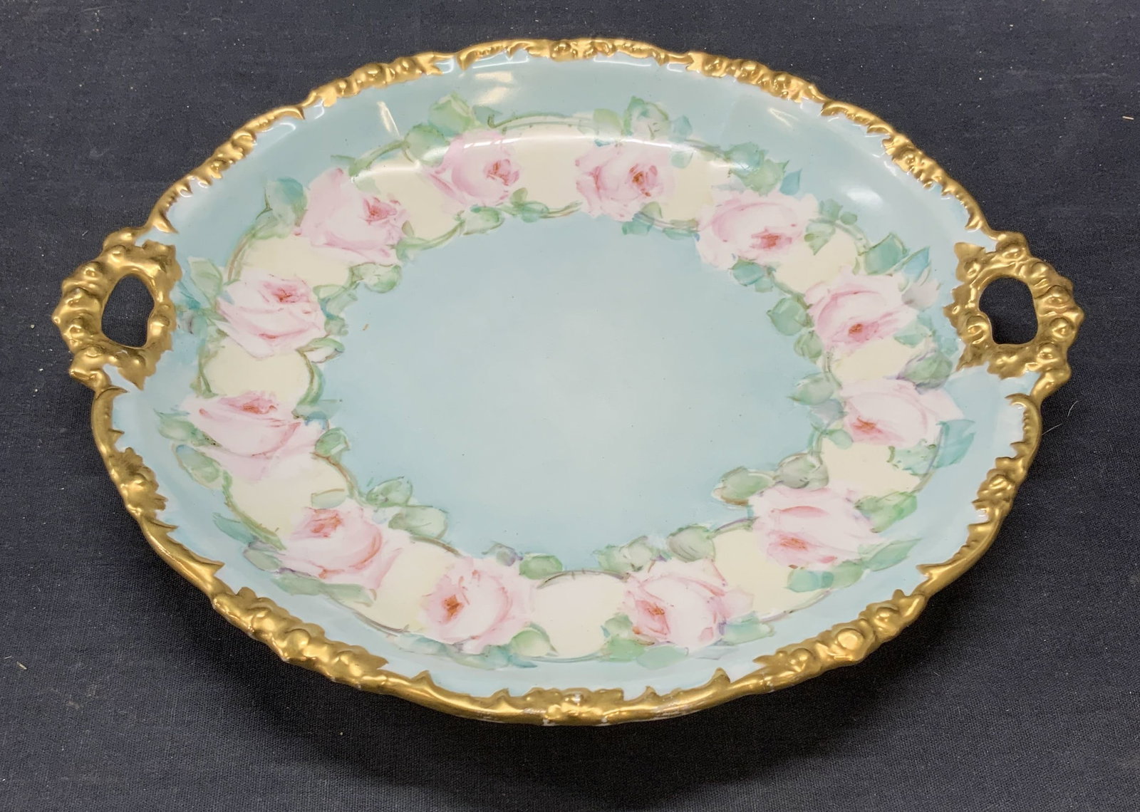 Antq JPL France Floral Porcelain Platter SME 1907: Antique JPL porcelain platter with hand painted floral motif in blue and pink with gilt decoration. Trademarked to underside. Made in France. Dated 1907. Measures approx. 10.25 x 1.5 inches. Some surf