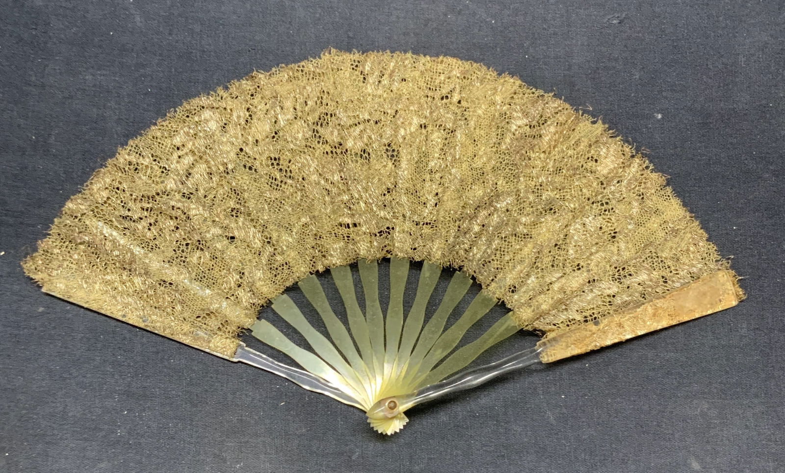 Vintage Gold Lace Childs Fan: Vintage childs fan. Gold lace with yellow and clear lucite frame. Measures approx. 6 x 11 inches. Some ear to material including tearing observed. Fan, vintage fan, collectible fan, childs fan, lace f