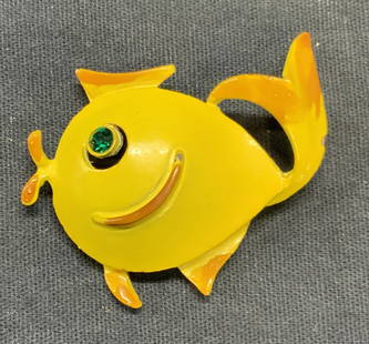 Vintage Yellow Enamel Crystal Fish Brooch: Vintage gold tone yellow enameled fish brooch with green crystal eye. Hinge pin to underside. Measures approx. 1.25 x 1.75 inches. Some surface wear including scratching observed. Estate jewelry,