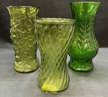 Lot 3 Vintage Molded Green Glass Vases: Lot of 3 vintage molded green glass vases. One piece marked FTD 1980, one piece marked illegibly. Largest vase measures approx. 4.75 x 10 inches. All pieces have some surface wear including