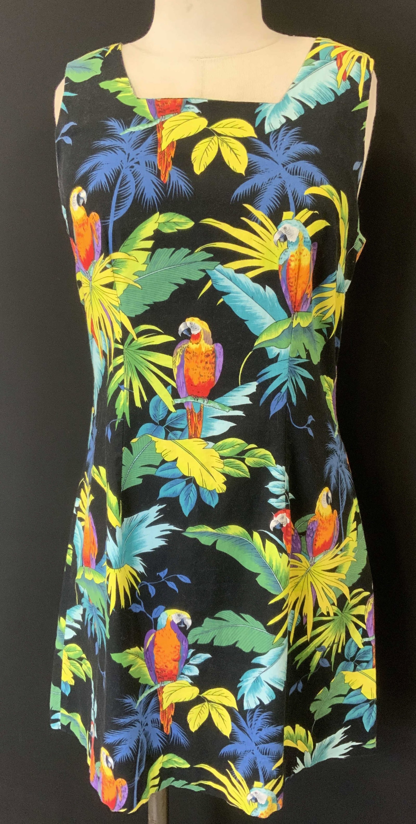 Shannon Marie Tropical Parrot Cotton Dress, Hawaii: Black dress with vibrant color jungle print and parrots. Made in Hawaii . Designer Shannon Marie. 31 in. Long x 30/32 in waist Summer dress, jungle print dress, parrot print dress, summer fashion, up 